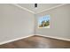 Spacious bedroom featuring hardwood floors and a window offering natural light at 710 W Plymouth St, Tampa, FL 33603