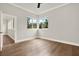 Spacious bedroom featuring corner windows, hardwood floors, and natural light at 710 W Plymouth St, Tampa, FL 33603