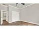 Bright bedroom boasts hardwood floors, a closet, and elegant white trim and fresh paint at 710 W Plymouth St, Tampa, FL 33603