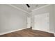 Bedroom featuring hardwood floors, neutral paint, and a spacious closet at 710 W Plymouth St, Tampa, FL 33603