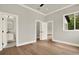 Bright, airy bedroom with hardwood floors and natural light, freshly painted, and updated doors at 710 W Plymouth St, Tampa, FL 33603