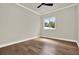 Modern bedroom featuring hardwood floors and a window providing ample natural light at 710 W Plymouth St, Tampa, FL 33603