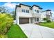 Modern home with striking architecture, stone accents, and a well-manicured lawn at 710 W Plymouth St, Tampa, FL 33603
