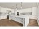 Stylish kitchen featuring a large island, stainless steel appliances, and modern cabinetry at 710 W Plymouth St, Tampa, FL 33603