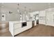 Open-concept kitchen with a marble island, stainless steel appliances, and modern fixtures at 710 W Plymouth St, Tampa, FL 33603