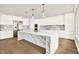A spacious, modern kitchen featuring a large island, stainless appliances, and stylish pendant lighting at 710 W Plymouth St, Tampa, FL 33603