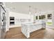Gourmet kitchen with a marble island, stainless steel appliances, and custom cabinetry at 710 W Plymouth St, Tampa, FL 33603