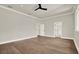 Spacious main bedroom featuring hardwood floors and multiple doors at 710 W Plymouth St, Tampa, FL 33603