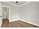 A neutral-colored room showcases hardwood floors and an entry way to the next level at 710 W Plymouth St, Tampa, FL 33603
