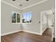 Bedroom featuring hardwood floors and outdoor views at 712 W Plymouth St, Tampa, FL 33603