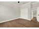 Spacious bedroom with hardwood floors, white trim and walk-in closet at 712 W Plymouth St, Tampa, FL 33603