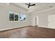 A spacious bedroom with large windows, hardwood floors, recessed lighting, and ceiling fan at 712 W Plymouth St, Tampa, FL 33603