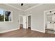 Bedroom featuring hardwood floors and access to the bathroom at 712 W Plymouth St, Tampa, FL 33603