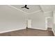 Spacious bedroom features hardwood floors, high ceilings, and a ceiling fan at 712 W Plymouth St, Tampa, FL 33603