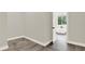 Bedroom leading into a bathroom with tiled floors and white trim throughout at 712 W Plymouth St, Tampa, FL 33603