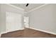 Spacious bedroom with hardwood floors, white trim and a walk-in closet at 712 W Plymouth St, Tampa, FL 33603