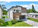 Striking exterior view of a two-story home with modern architectural design, brown and white facade at 712 W Plymouth St, Tampa, FL 33603