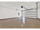 A well-lit garage features an epoxy floor, recessed lighting, and an automatic door opener at 712 W Plymouth St, Tampa, FL 33603
