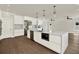 Modern kitchen with stainless steel appliances, quartz countertops and hardwood floors at 712 W Plymouth St, Tampa, FL 33603