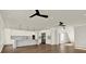 Open-concept kitchen and living area with modern finishes, hardwood floors, and sleek lighting fixtures at 712 W Plymouth St, Tampa, FL 33603