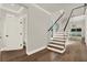 A modern staircase with glass railings and hardwood floors is showcased at 712 W Plymouth St, Tampa, FL 33603