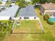 Aerial view of the property showcasing the fenced backyard and neighborhood surroundings at 7157 Hamilton Park Blvd, Tampa, FL 33615