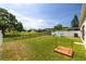 Spacious backyard featuring a playground and beautiful green space perfect for outdoor activities at 7157 Hamilton Park Blvd, Tampa, FL 33615