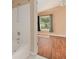 Bright bathroom with white tiled shower/tub combination at 7157 Hamilton Park Blvd, Tampa, FL 33615