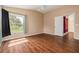 Bedroom featuring hard wood floors, ceiling fan and window at 7157 Hamilton Park Blvd, Tampa, FL 33615