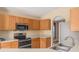 Modern kitchen featuring stainless steel appliances, ample counter space, and stylish cabinetry at 7157 Hamilton Park Blvd, Tampa, FL 33615