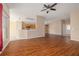 Inviting living space with hardwood floors and a smooth transition into a modern kitchen at 7157 Hamilton Park Blvd, Tampa, FL 33615