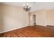 Spacious living room with wood floors and chandelier at 7157 Hamilton Park Blvd, Tampa, FL 33615