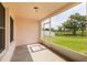 Screened patio offering a relaxing outdoor space with views of the backyard and green space at 7157 Hamilton Park Blvd, Tampa, FL 33615