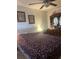 A well-furnished bedroom with a decorative dresser and framed artwork at 7206 Reindeer Rd, Tampa, FL 33619