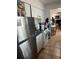 Well-equipped kitchen featuring white cabinetry, modern appliances, and a practical layout at 7206 Reindeer Rd, Tampa, FL 33619