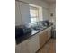 Efficient kitchen space with functional appliances and abundant counter space at 7206 Reindeer Rd, Tampa, FL 33619