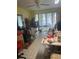 A cluttered room with tile flooring and a ceiling fan at 7206 Reindeer Rd, Tampa, FL 33619