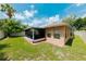 Home boasts an enclosed patio that provides a smooth transition to the spacious, green backyard at 9852 Laurel Ledge Dr, Riverview, FL 33569