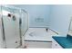 Bathroom with large shower, soaking tub, and blue tiled accents for a clean, spa-like experience at 9852 Laurel Ledge Dr, Riverview, FL 33569