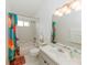 Bright bathroom with a white vanity, bathtub, and updated fixtures at 9852 Laurel Ledge Dr, Riverview, FL 33569