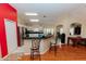 View of the kitchen and breakfast bar with open living area and stainless steel appliances at 9852 Laurel Ledge Dr, Riverview, FL 33569