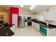 Well-lit kitchen features granite counters, stainless steel appliances and ample cabinet space at 9852 Laurel Ledge Dr, Riverview, FL 33569