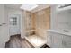 Modern bathroom featuring a glass-enclosed shower with a built-in seat, updated fixtures, and a contemporary vanity at 1004 Black Knight Dr, Valrico, FL 33594
