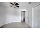 Simple bedroom with a ceiling fan, carpet flooring, and a closet at 1004 Black Knight Dr, Valrico, FL 33594