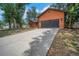 The home features a long driveway leading to a spacious two-car garage at 1004 Black Knight Dr, Valrico, FL 33594
