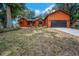 Charming one-story home featuring a two-car garage, inviting front porch, and well-maintained lawn at 1004 Black Knight Dr, Valrico, FL 33594