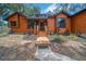 Welcoming front porch with updated wooden details and charming front yard at 1004 Black Knight Dr, Valrico, FL 33594