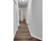 The hallway features wood floors, white trim, and access to multiple rooms at 1004 Black Knight Dr, Valrico, FL 33594