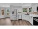 The kitchen features stainless steel appliances and ample counter space at 1004 Black Knight Dr, Valrico, FL 33594