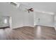 Open living area featuring vaulted ceilings, hardwood floors, and bright natural light at 1004 Black Knight Dr, Valrico, FL 33594
